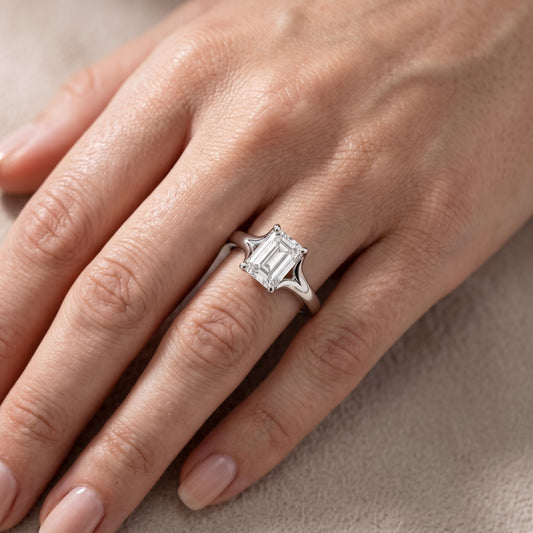 Nell Split Shank Solitaire Emerald Diamond Engagement Ring in Platinum - lifestyle.jpg