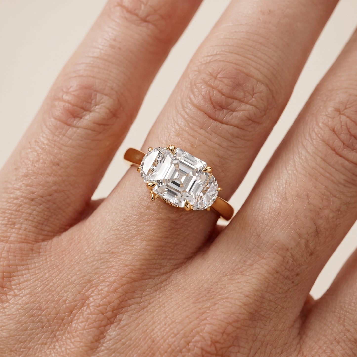 Romy Three-Stone Asscher Diamond Engagement Ring in Yellow Gold - lifestyle.jpg