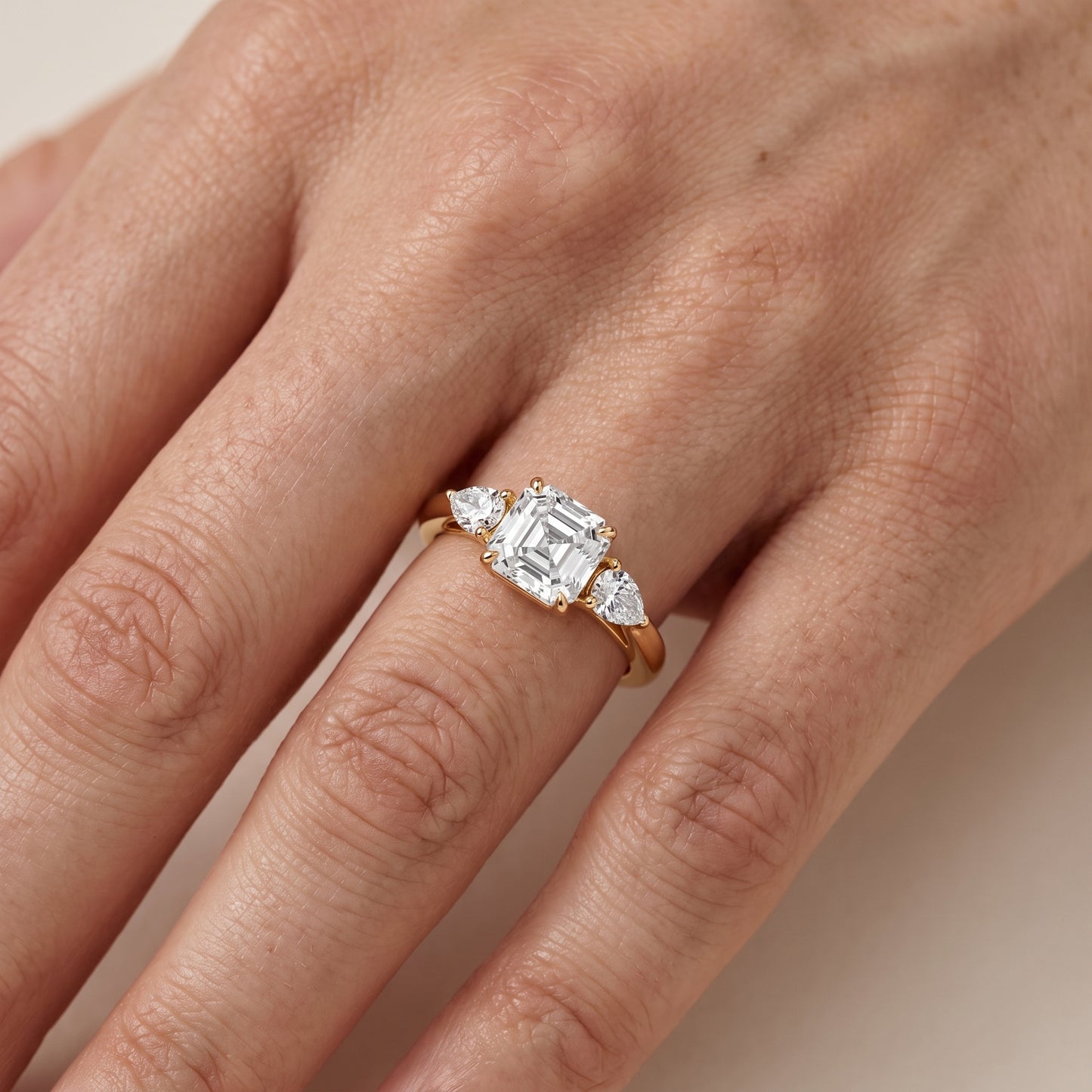 Phoebe Three-Stone Asscher Diamond Ring in Yellow Gold - lifestyle.jpg