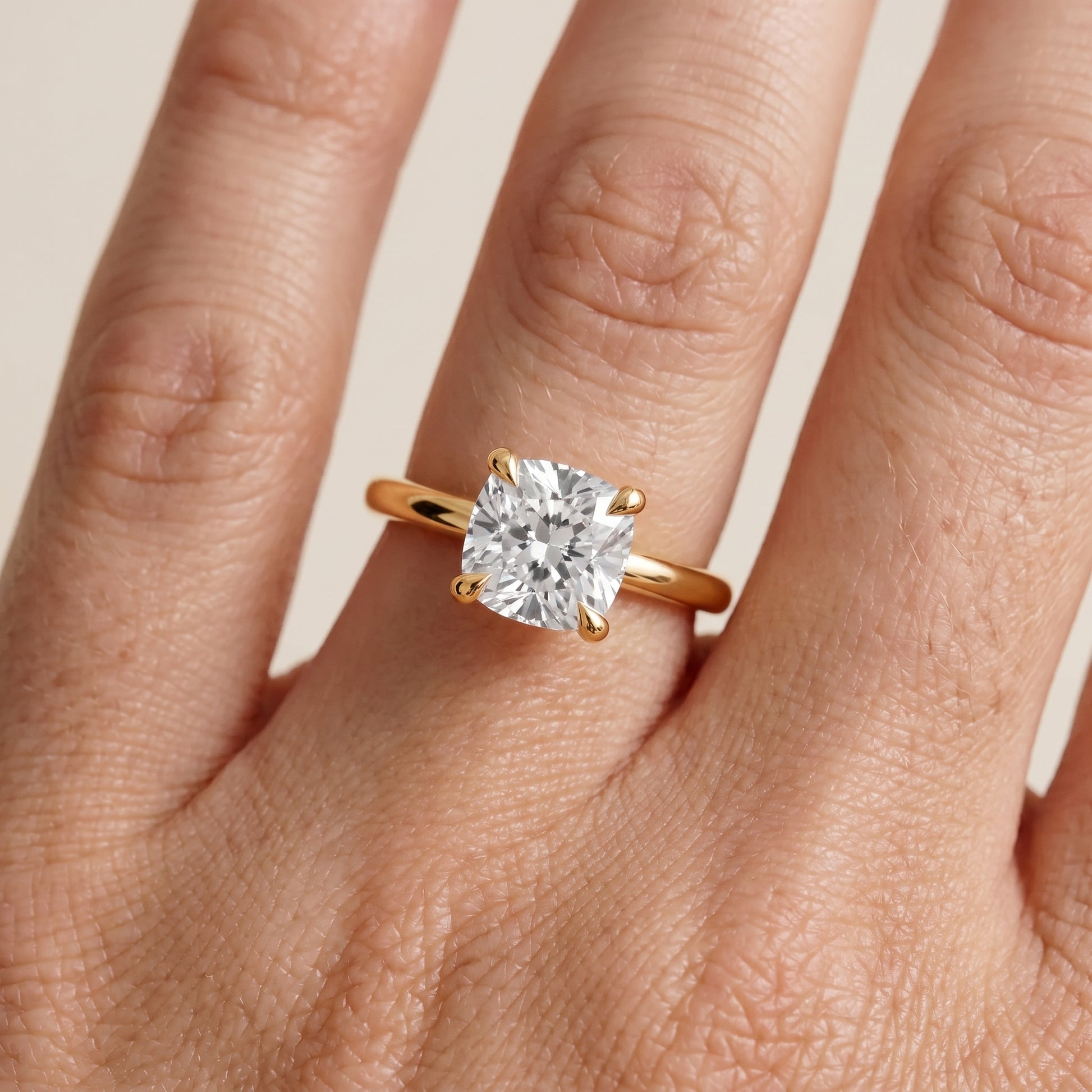 Nella Petite Solitaire Cushion Diamond Engagement Ring in Yellow Gold - lifestyle.jpg