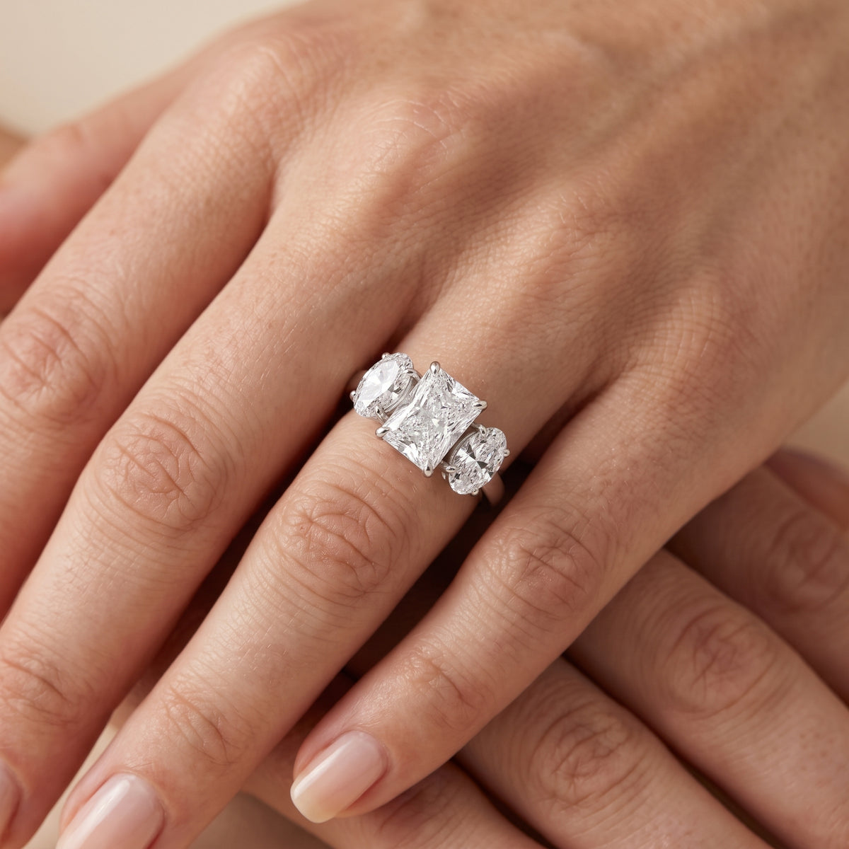 Lila Three-Stone Radiant Diamond Engagement Ring in Platinum - lifestyle.jpg