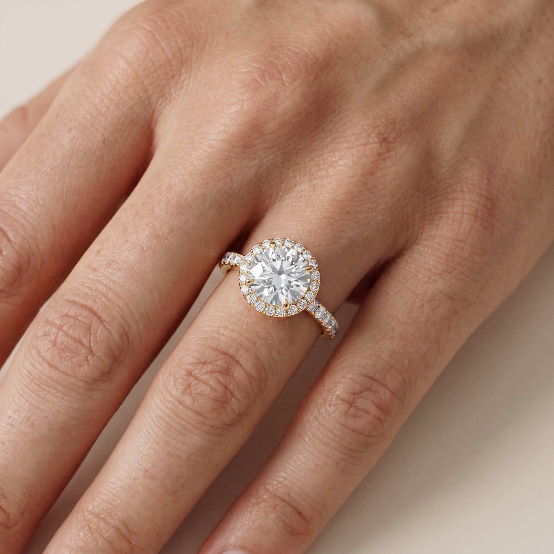 Chloe Halo Pavé Round Diamond Ring in Yellow Gold - lifestyle.jpg