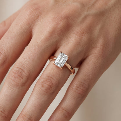 Lucia Solitaire Six-Prong Emerald Diamond Engagement Ring in Rose Gold - lifestyle.jpg