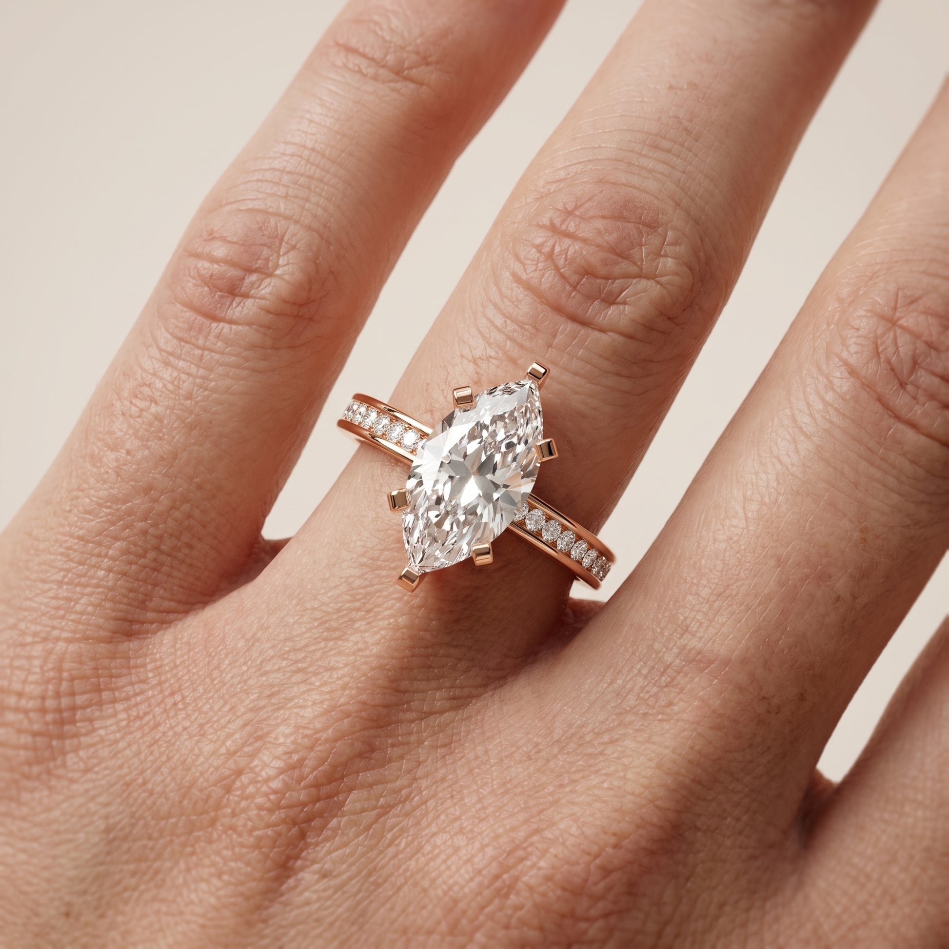 Tessa Solitaire Channel Set Marquise Diamond Engagement Ring in Rose Gold - lifestyle.jpg