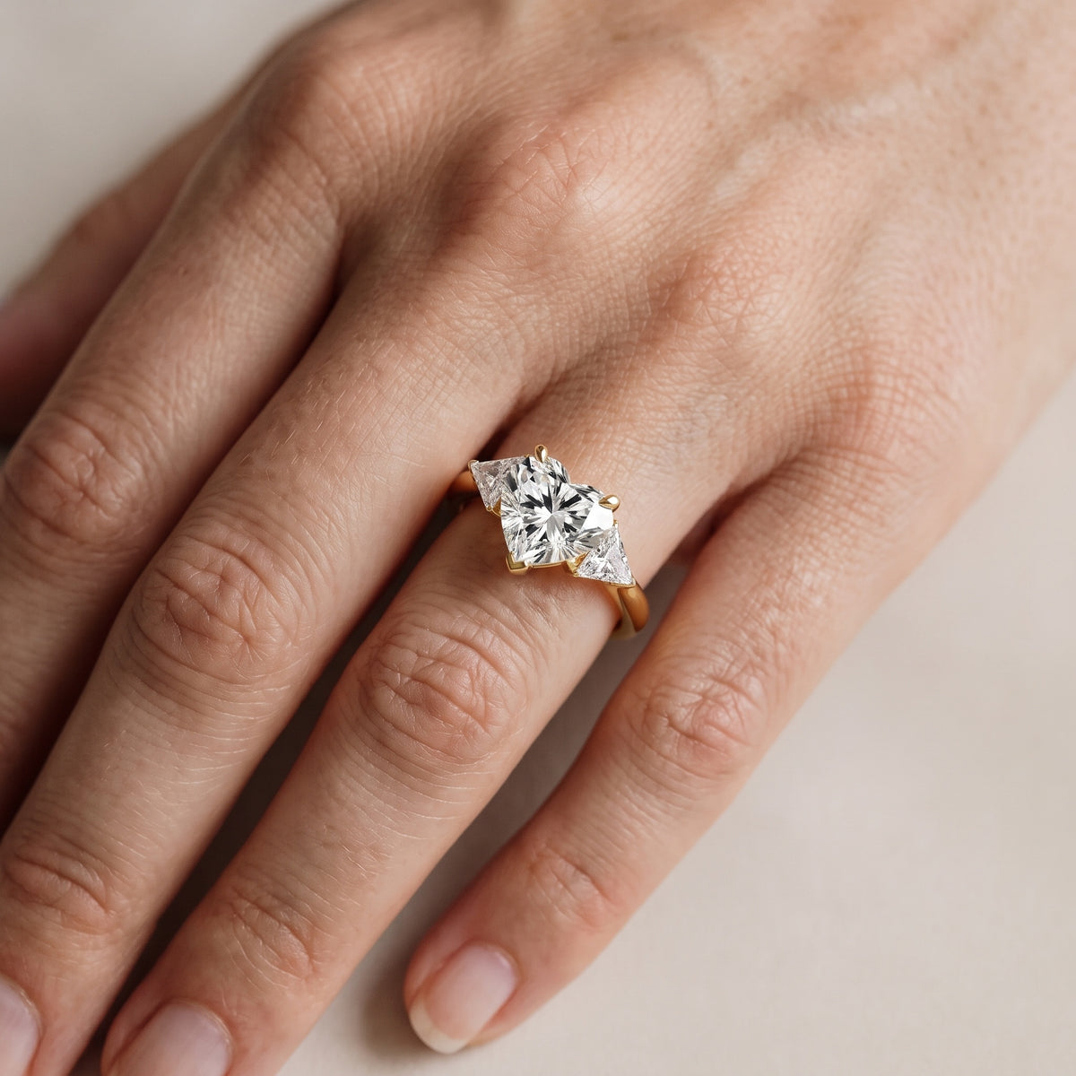 Clemency Three-Stone Cathedral Heart Diamond Engagement Ring in Rose Gold - lifestyle.jpg