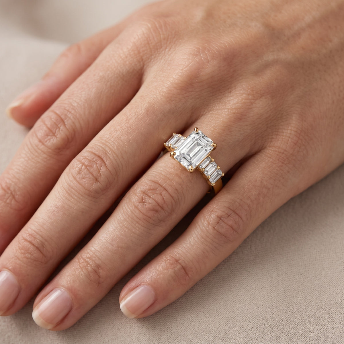 Lark Baguette Five-Stone Emerald Diamond Engagement Ring in Yellow Gold - lifestyle.jpg