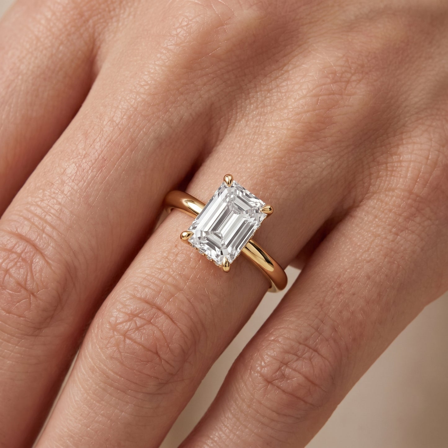 Amaya Hidden Halo Emerald Diamond Engagement Ring in Yellow Gold - lifestyle.jpg
