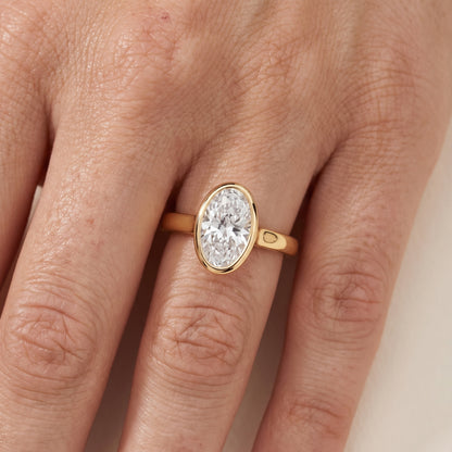 Jolie Bezel Solitaire Oval Diamond Engagement Ring in Yellow Gold - lifestyle.jpg