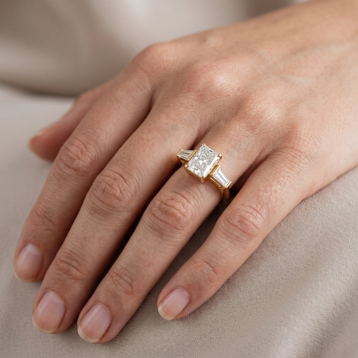 Layla Tapered Baguette Radiant Diamond Engagement Ring in Yellow Gold - lifestyle.jpg