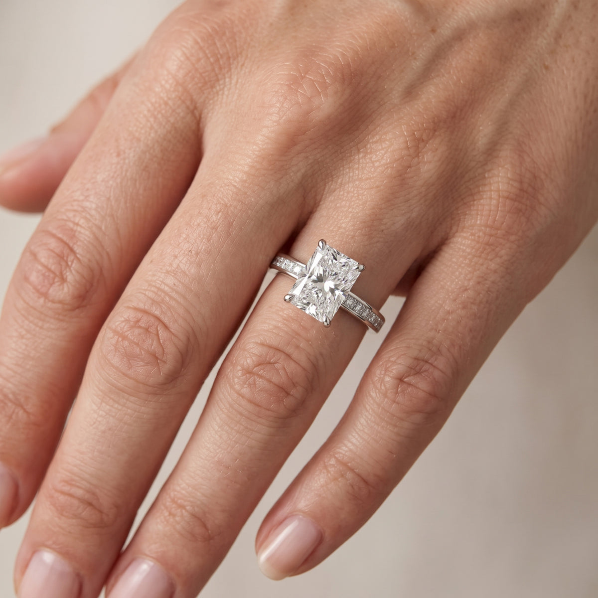Maren Sidestone Channel Set Radiant Diamond Engagement Ring in Platinum - lifestyle.jpg