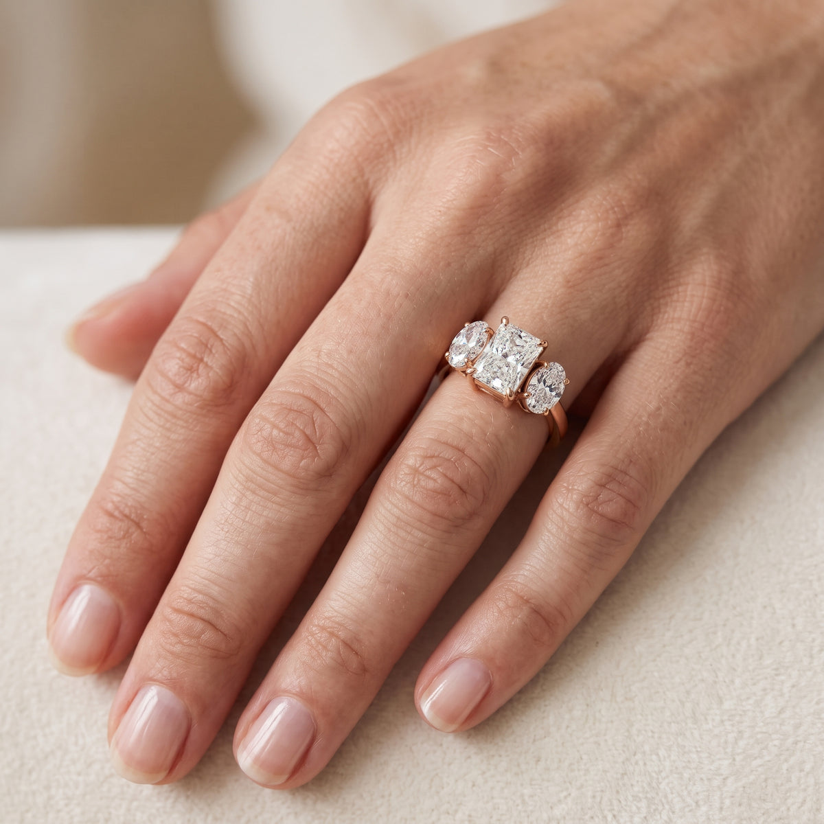 Lila Three-Stone Radiant Diamond Engagement Ring in Rose Gold - lifestyle.jpg