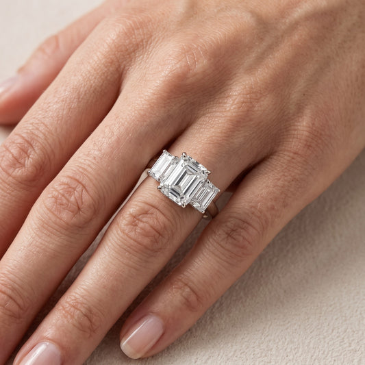Marian Three-Stone Hidden Halo Emerald Diamond Engagement Ring in Platinum - lifestyle.jpg