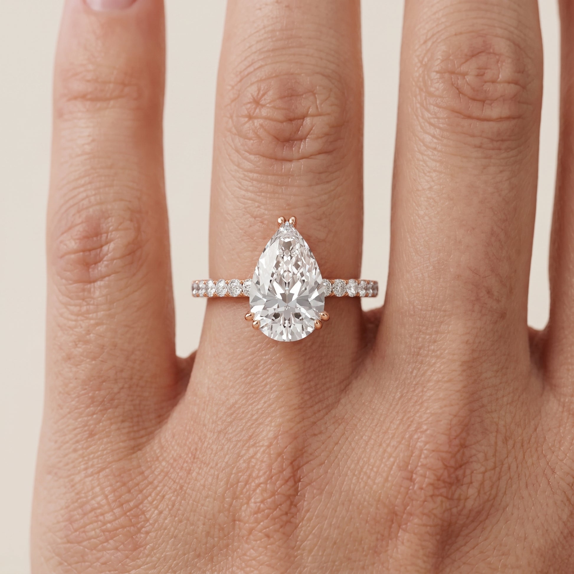 Novara Solitaire Pavé Pear Diamond Ring in Rose Gold - lifestyle.jpg