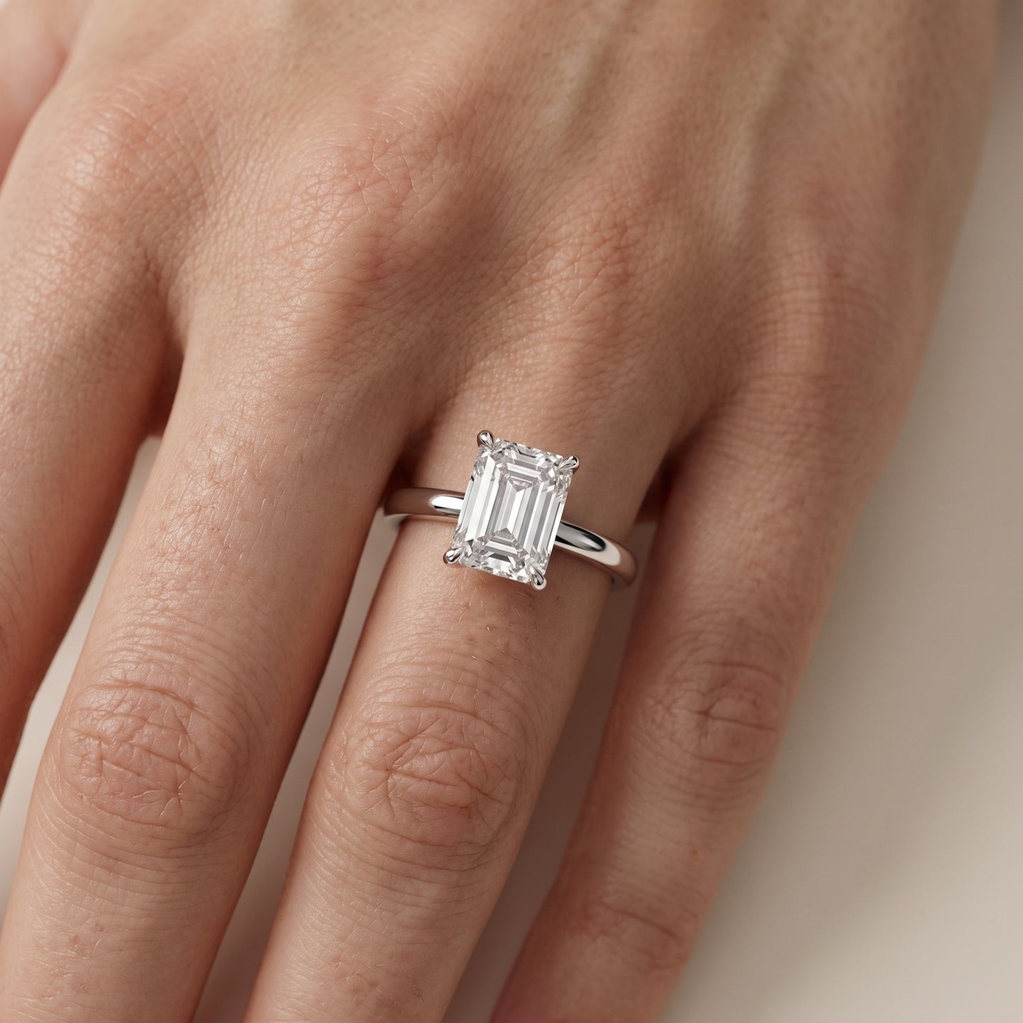 Lyla Petite Solitaire Emerald Diamond Engagement Ring in Platinum - lifestyle.jpg