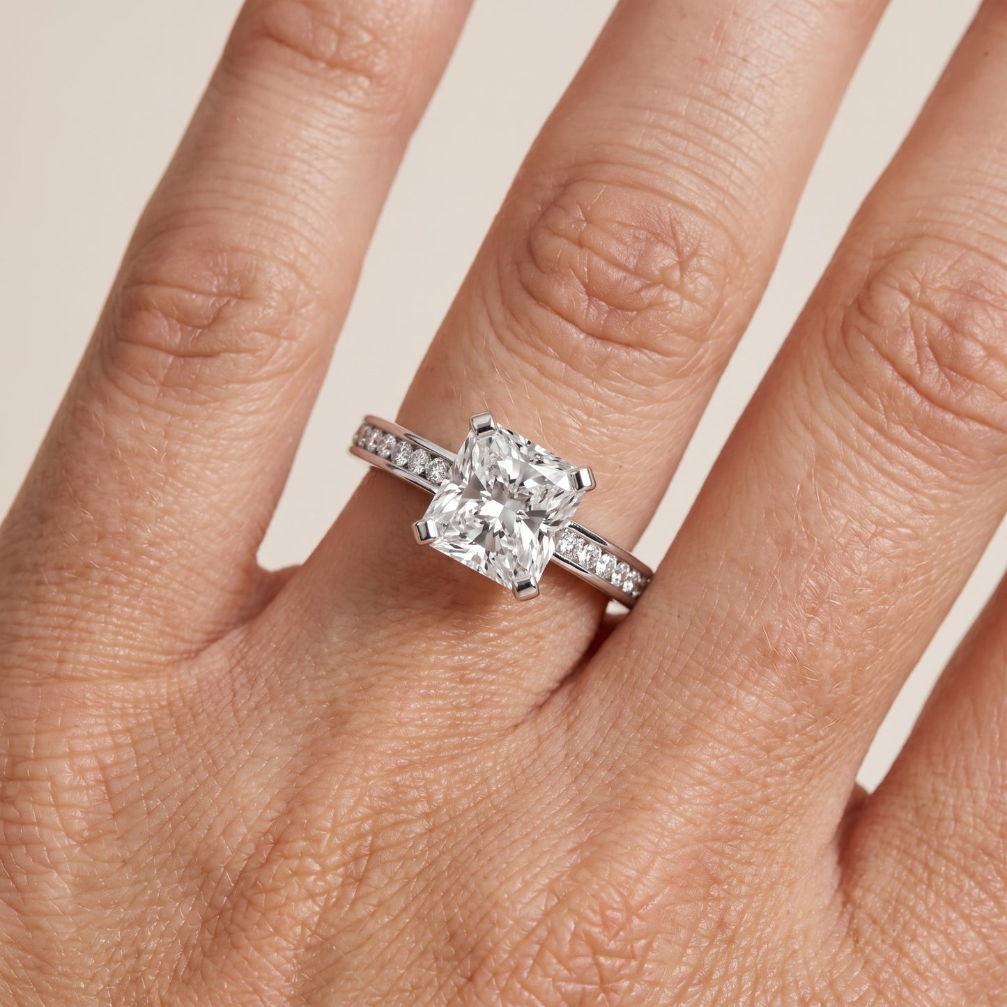 Tessa Solitaire Channel Set Radiant Diamond Engagement Ring in Platinum - lifestyle.jpg