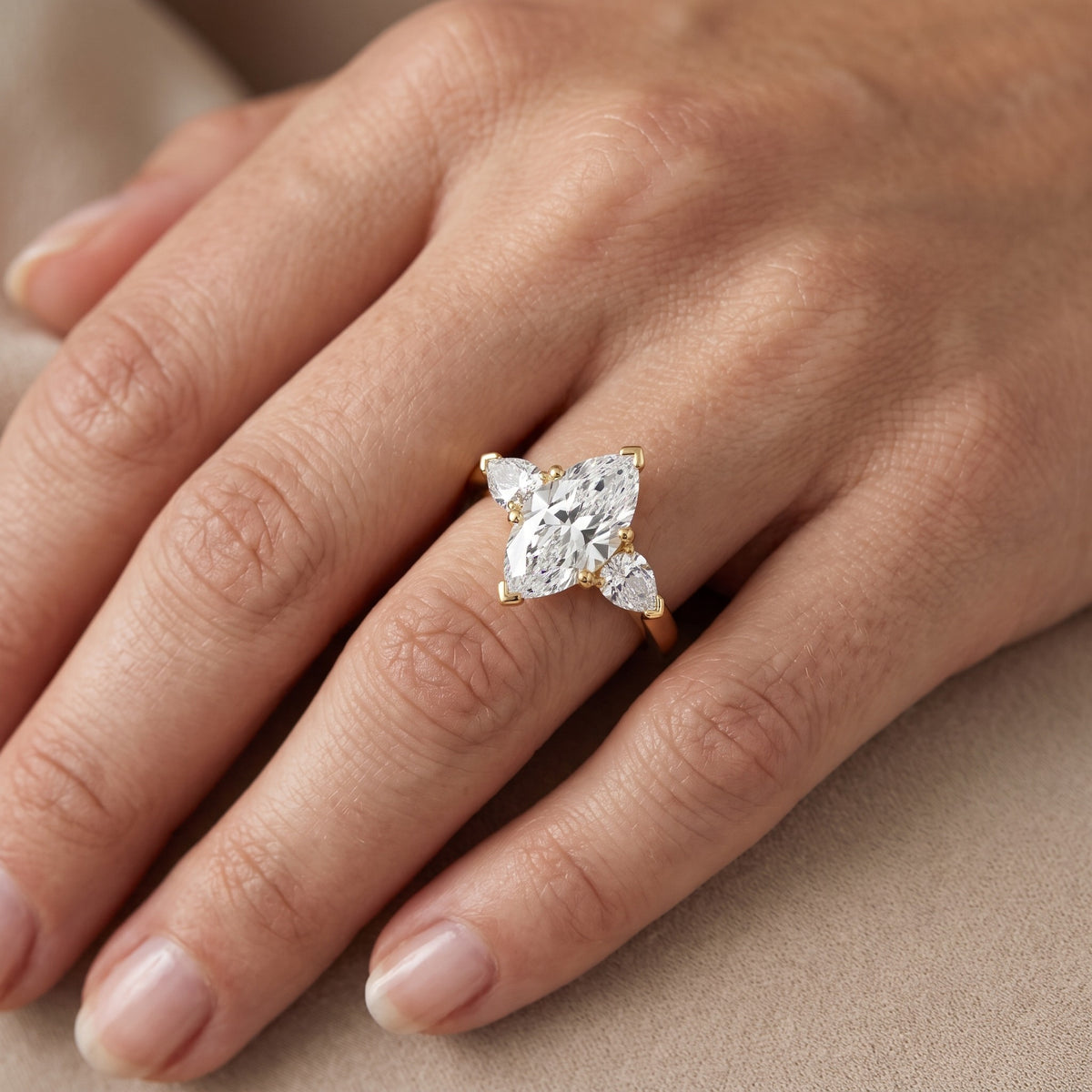 Amabel Three-Stone Marquise Diamond Engagement Ring in White Gold - lifestyle.jpg