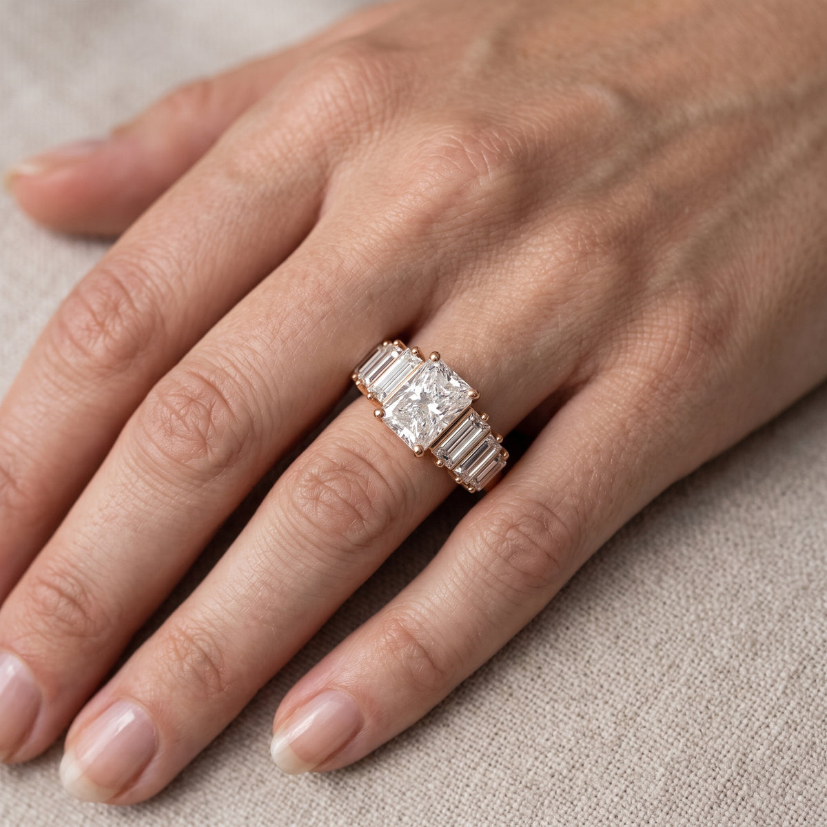Mara Sidestone Baguette Accent Radiant Diamond Engagement Ring in Rose Gold - lifestyle.jpg