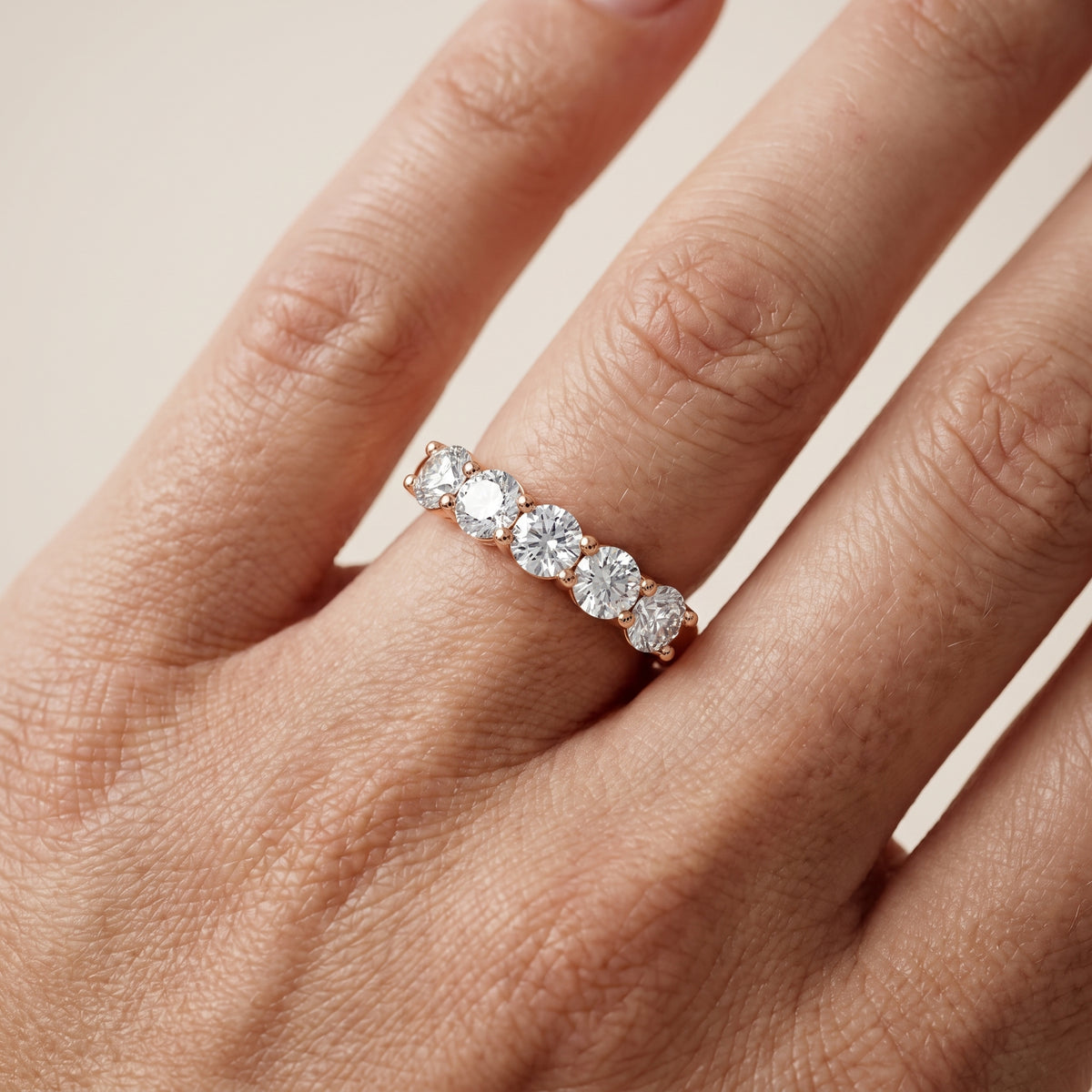 Cecilia Shared Prong Round Diamond Wedding Band in Rose Gold - lifestyle.jpg