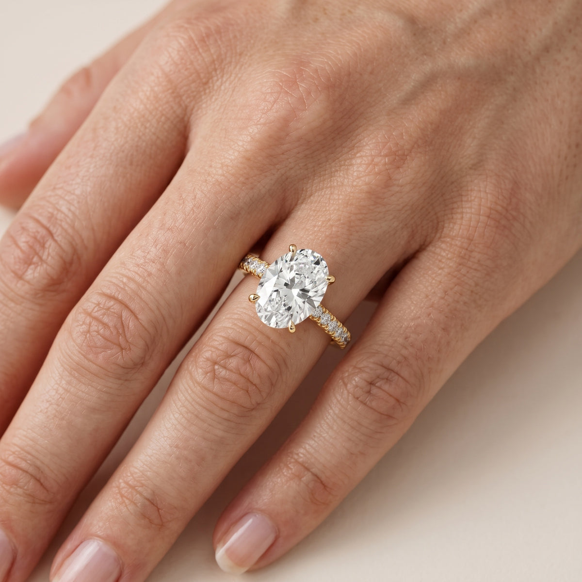 Iona French Pavé Oval Diamond Engagement Ring in Yellow Gold - lifestyle.jpg