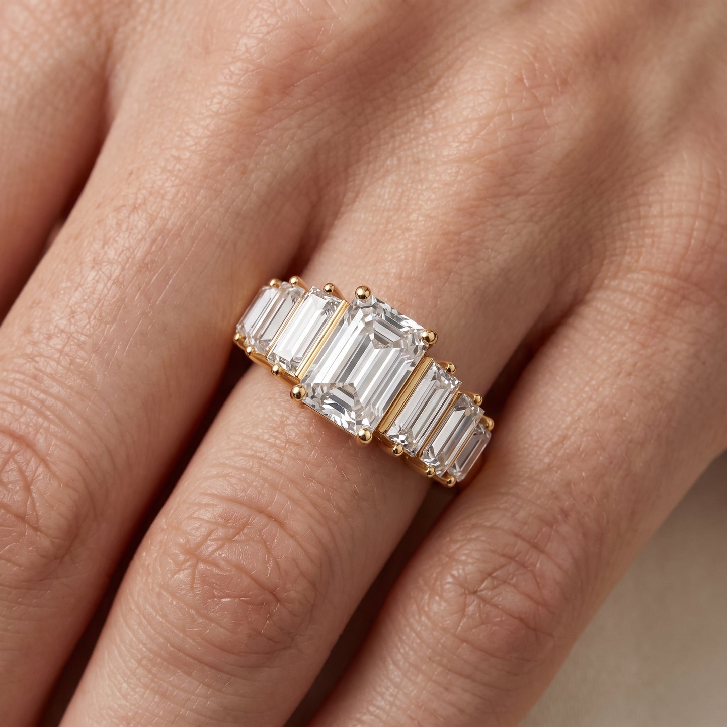 Mara Sidestone Baguette Accent Emerald Diamond Engagement Ring in Yellow Gold - lifestyle.jpg