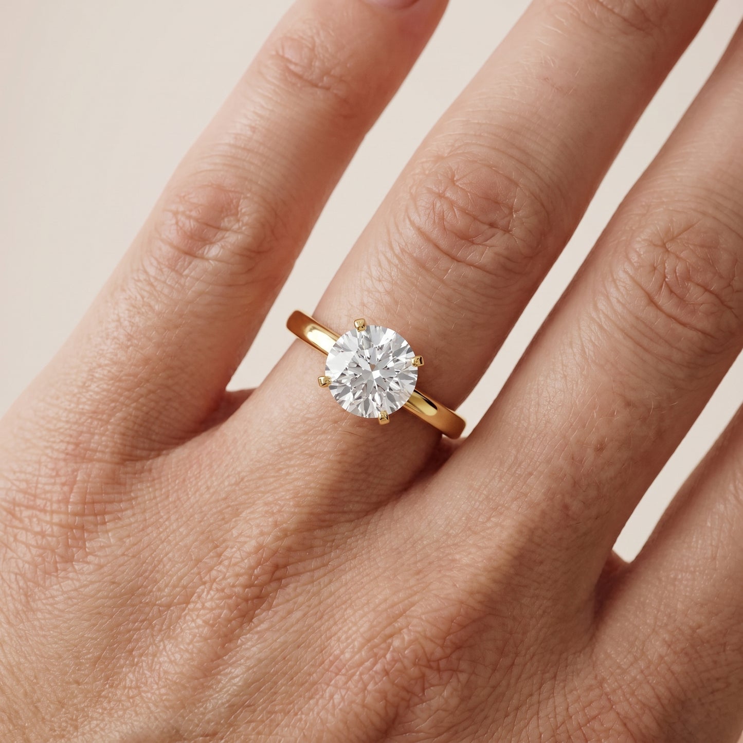 Liana Solitaire Claw Prong Round Diamond Engagement Ring in Yellow Gold - lifestyle.jpg