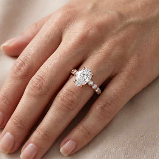 Piper Sidestone Pear Diamond Engagement Ring in Rose Gold - lifestyle.jpg