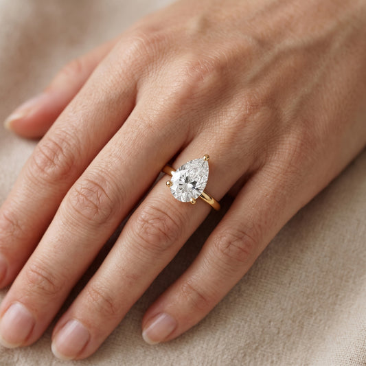 Maisie Four Prong Solitaire Pear Diamond Engagement Ring in Yellow Gold - lifestyle.jpg