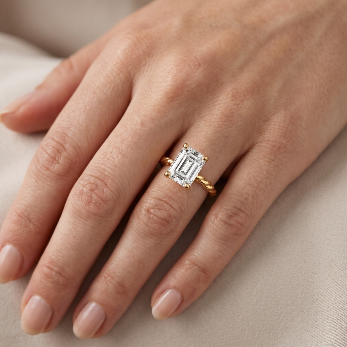 Robyn Twist Solitaire Emerald Diamond Engagement Ring in Silver - lifestyle.jpg
