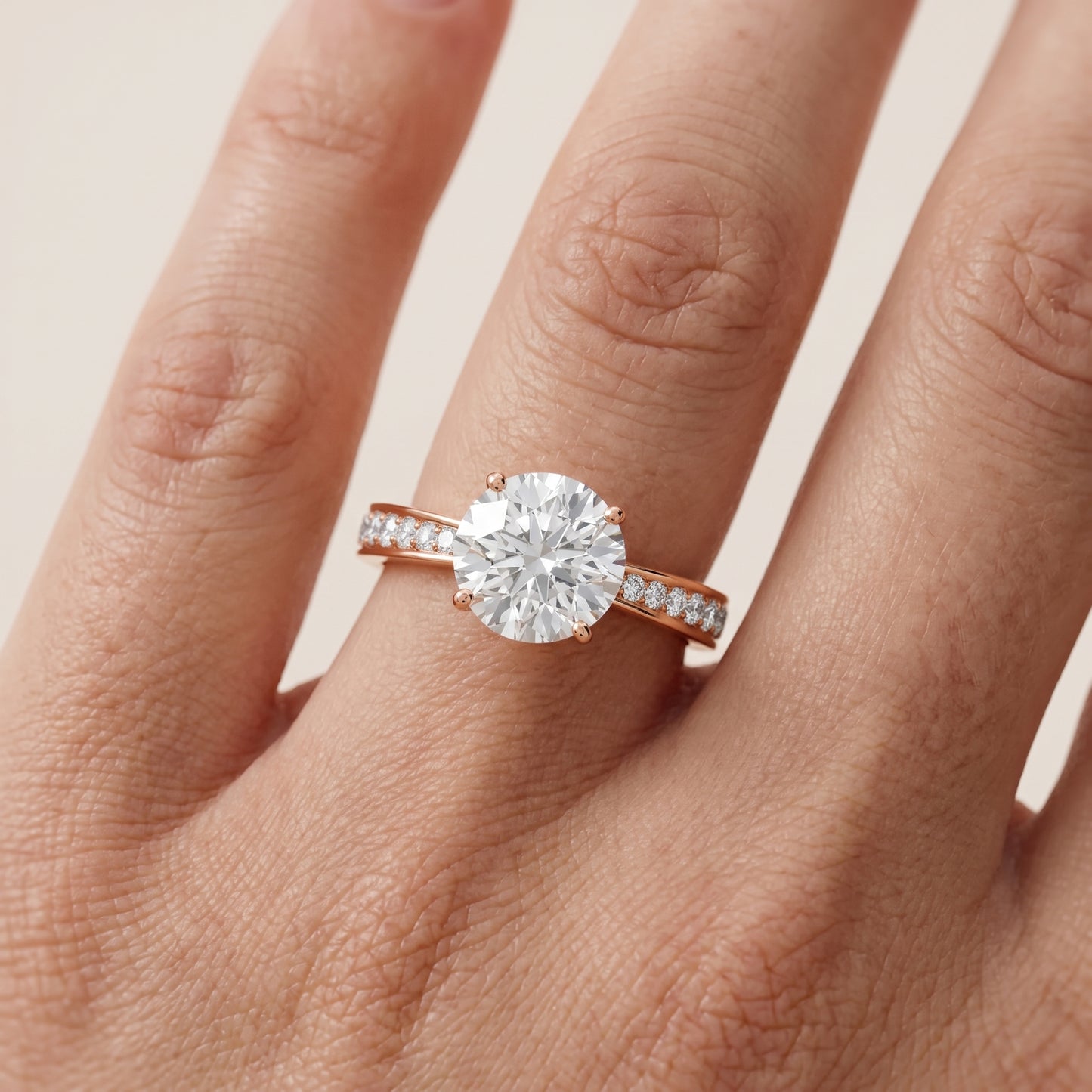 Rhea Sidestone Pavé Round Diamond Engagement Ring in Rose Gold - lifestyle.jpg