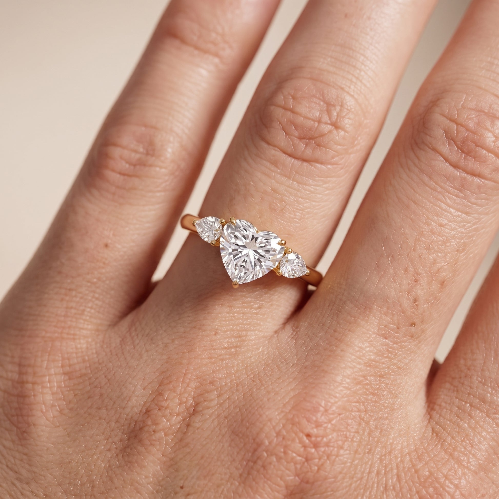 Phoebe Three-Stone Heart Diamond Ring in Yellow Gold - lifestyle.jpg