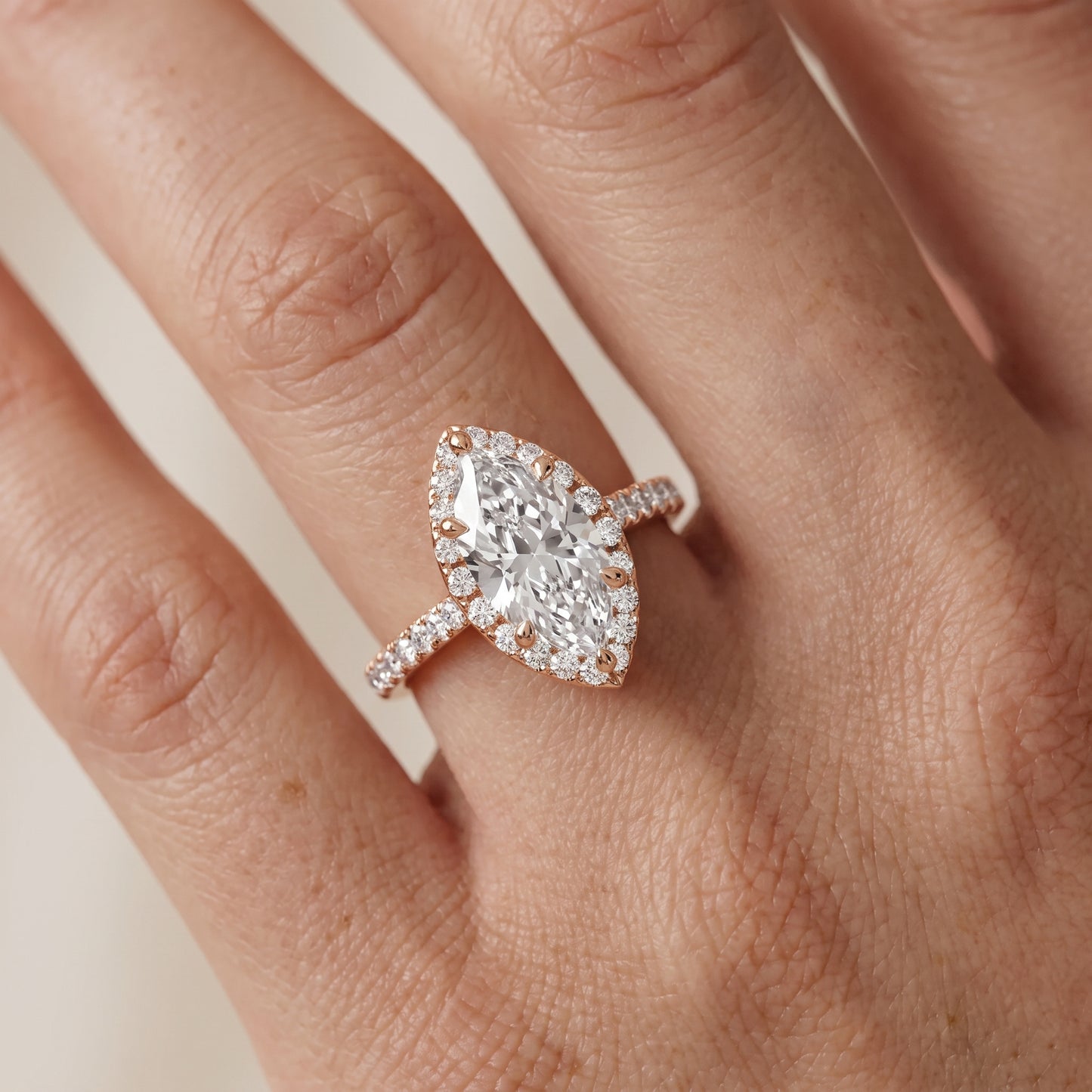 Amara Halo Claw Prong Marquise Diamond Ring in Rose Gold - lifestyle.jpg