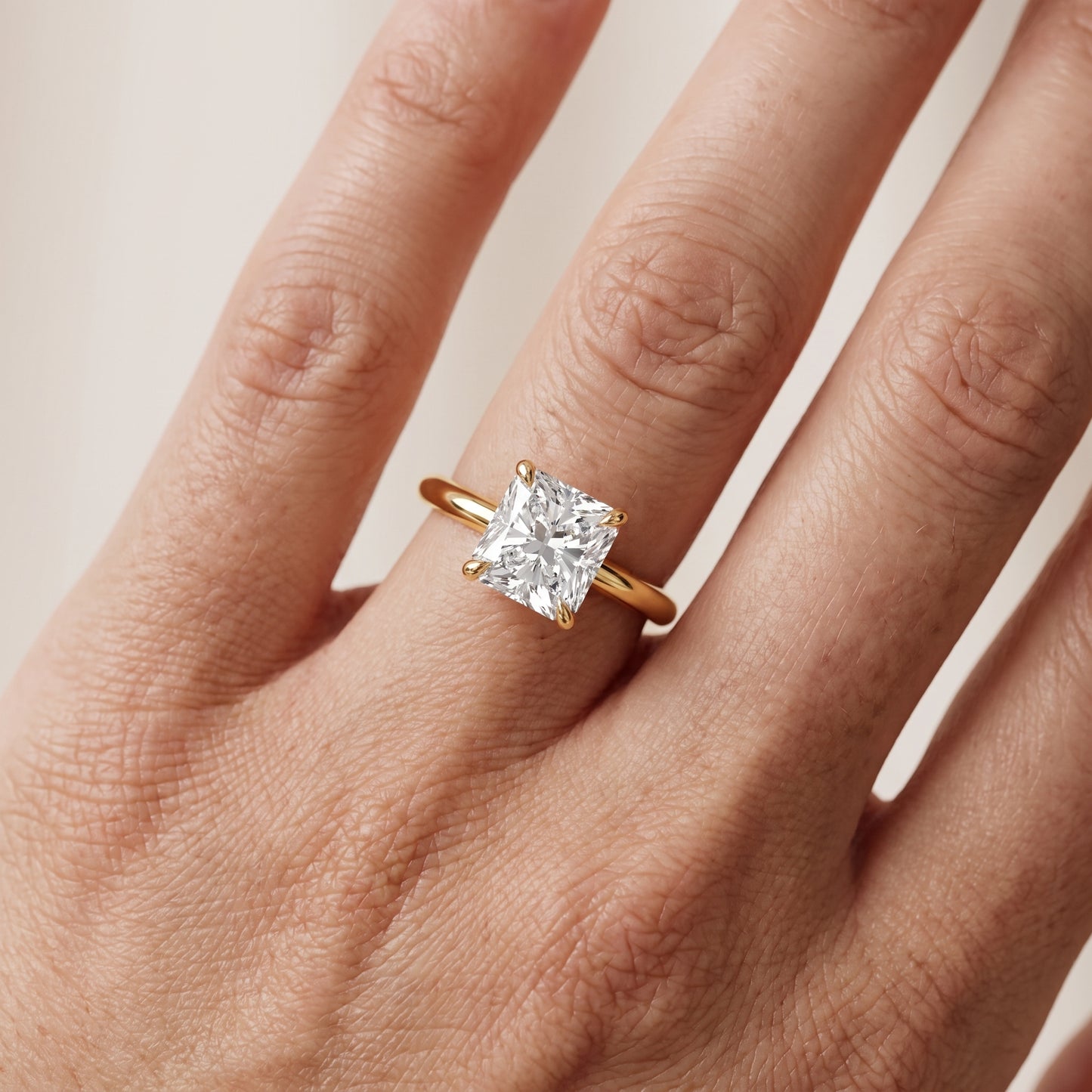 Amaya Hidden Halo Radiant Diamond Ring in Yellow Gold - lifestyle.jpg