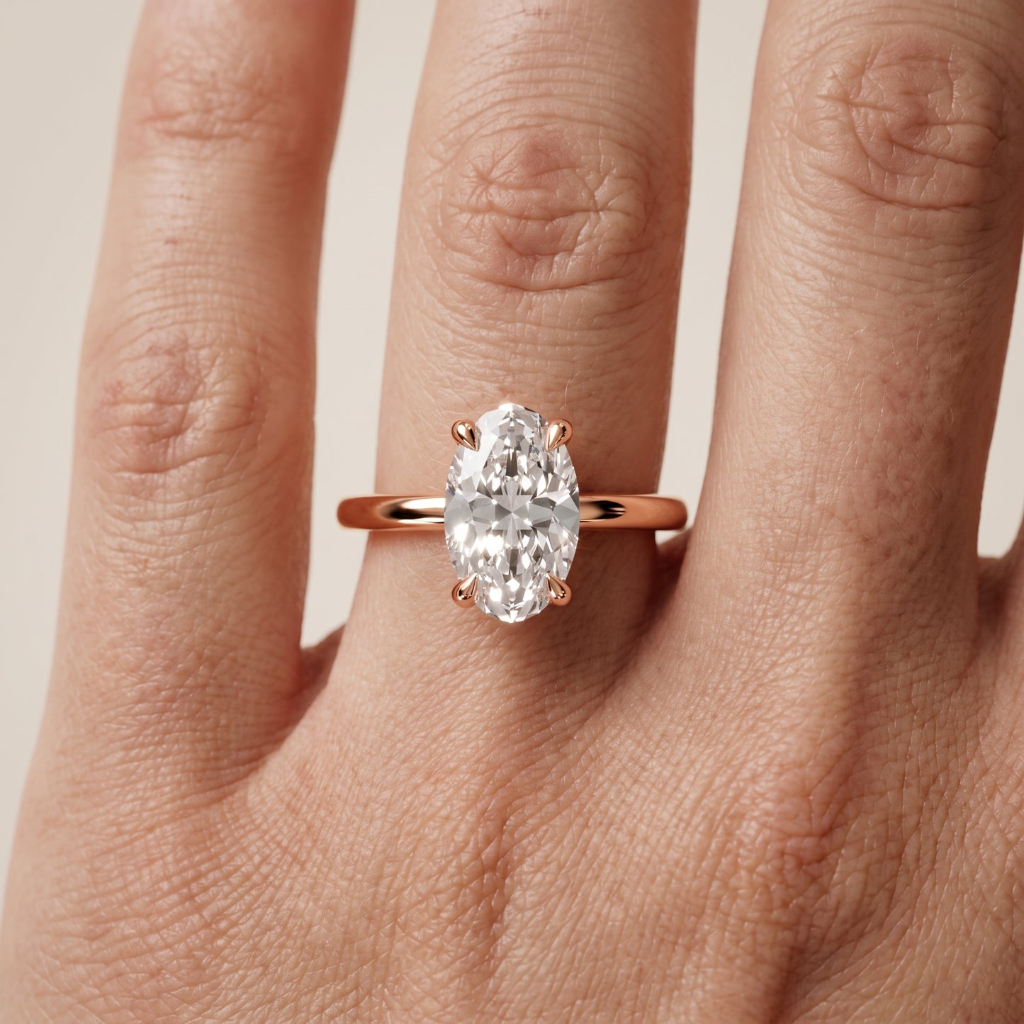 Nella Petite Solitaire Oval Diamond Engagement Ring in Rose Gold - lifestyle.jpg