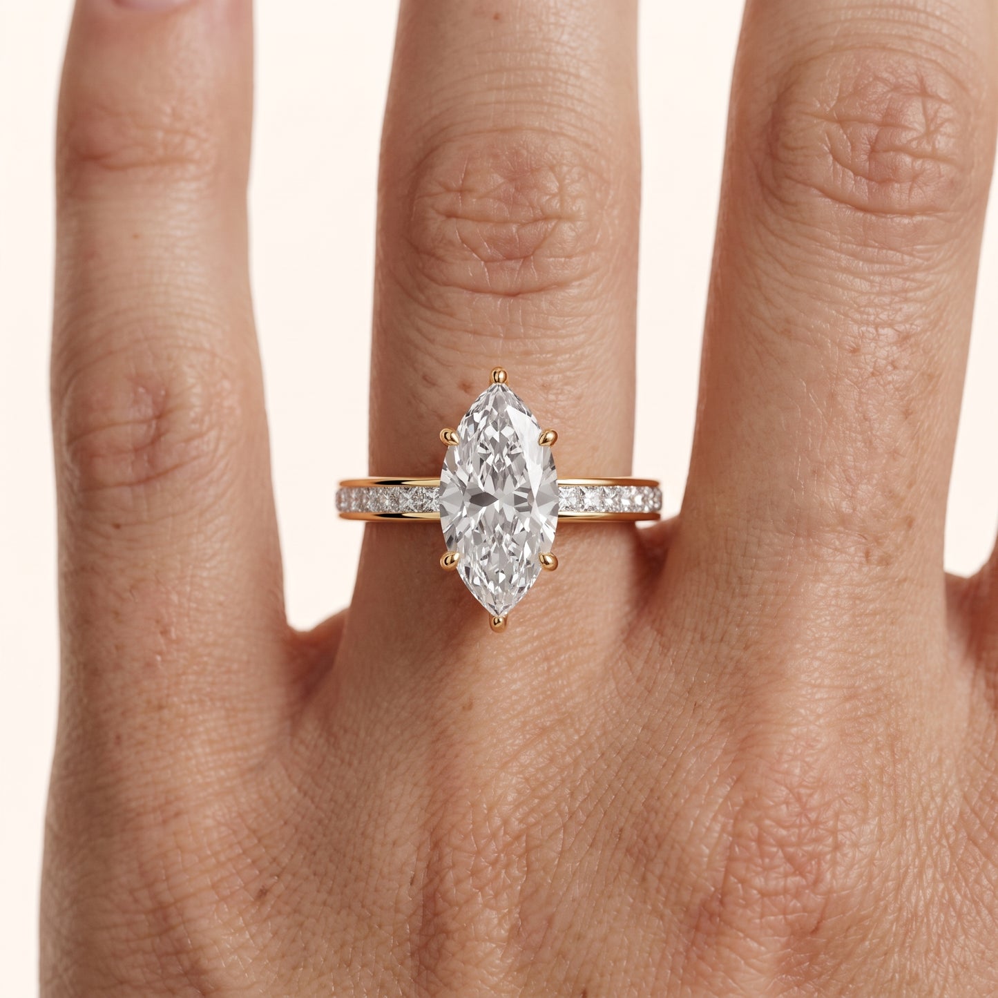 Brielle Channel Set Solitaire Marquise Diamond Ring in Yellow Gold - lifestyle.jpg