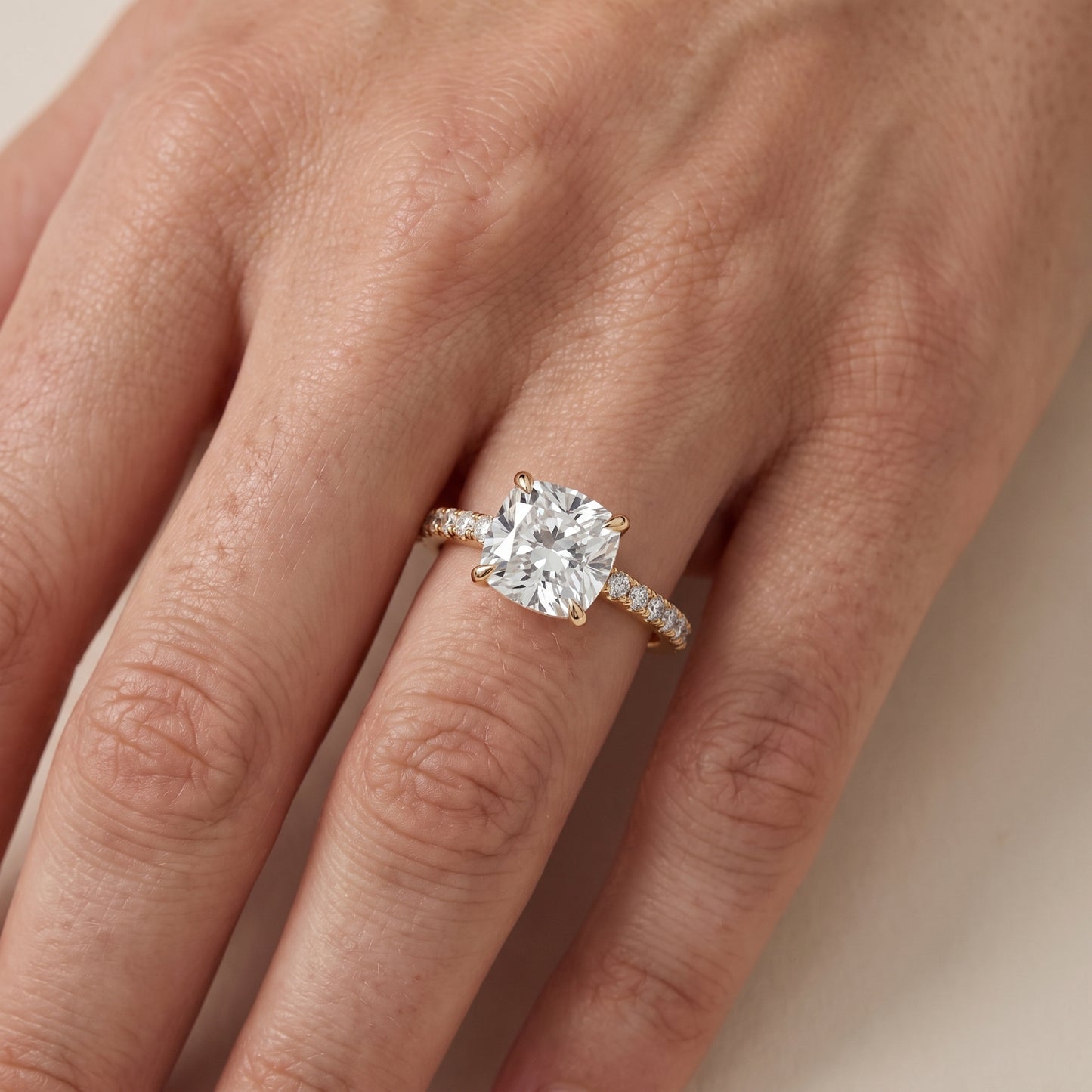 Ione Solitaire Pavé Cushion Diamond Engagement Ring in Yellow Gold - lifestyle.jpg