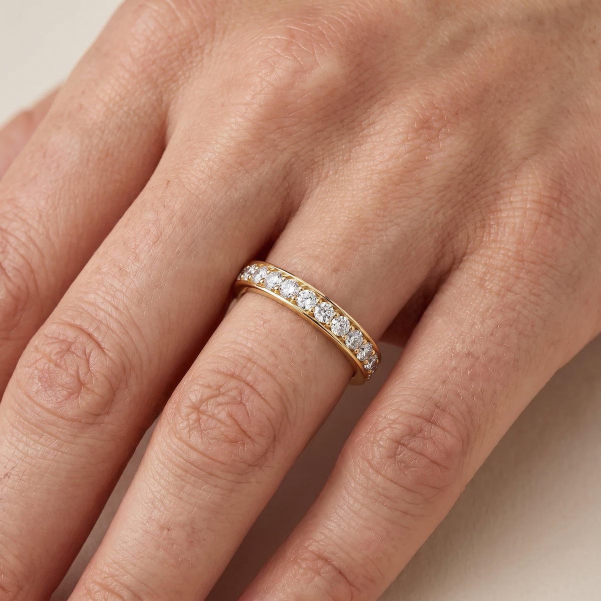 Constance Channel Set Round Diamond Eternity Band in Yellow Gold - lifestyle.jpg