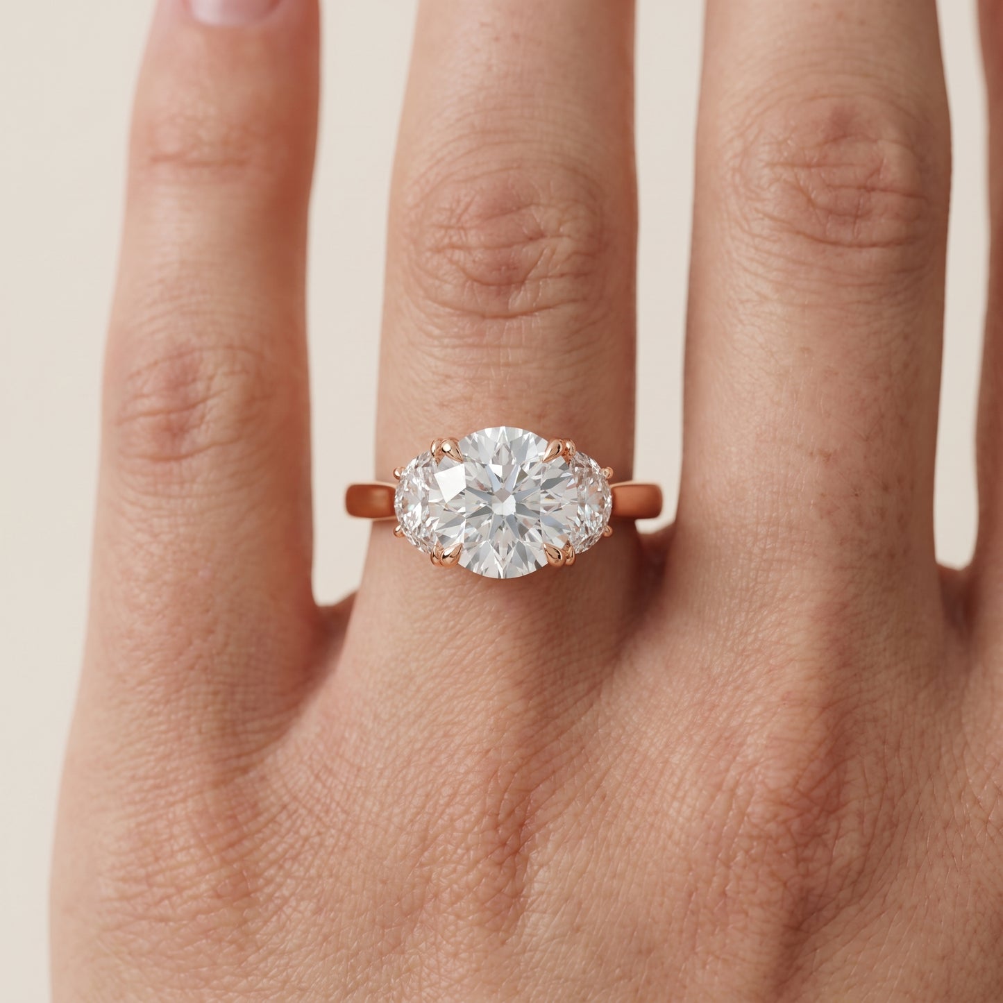 Romy Three-Stone Round Diamond Engagement Ring in Rose Gold - lifestyle.jpg