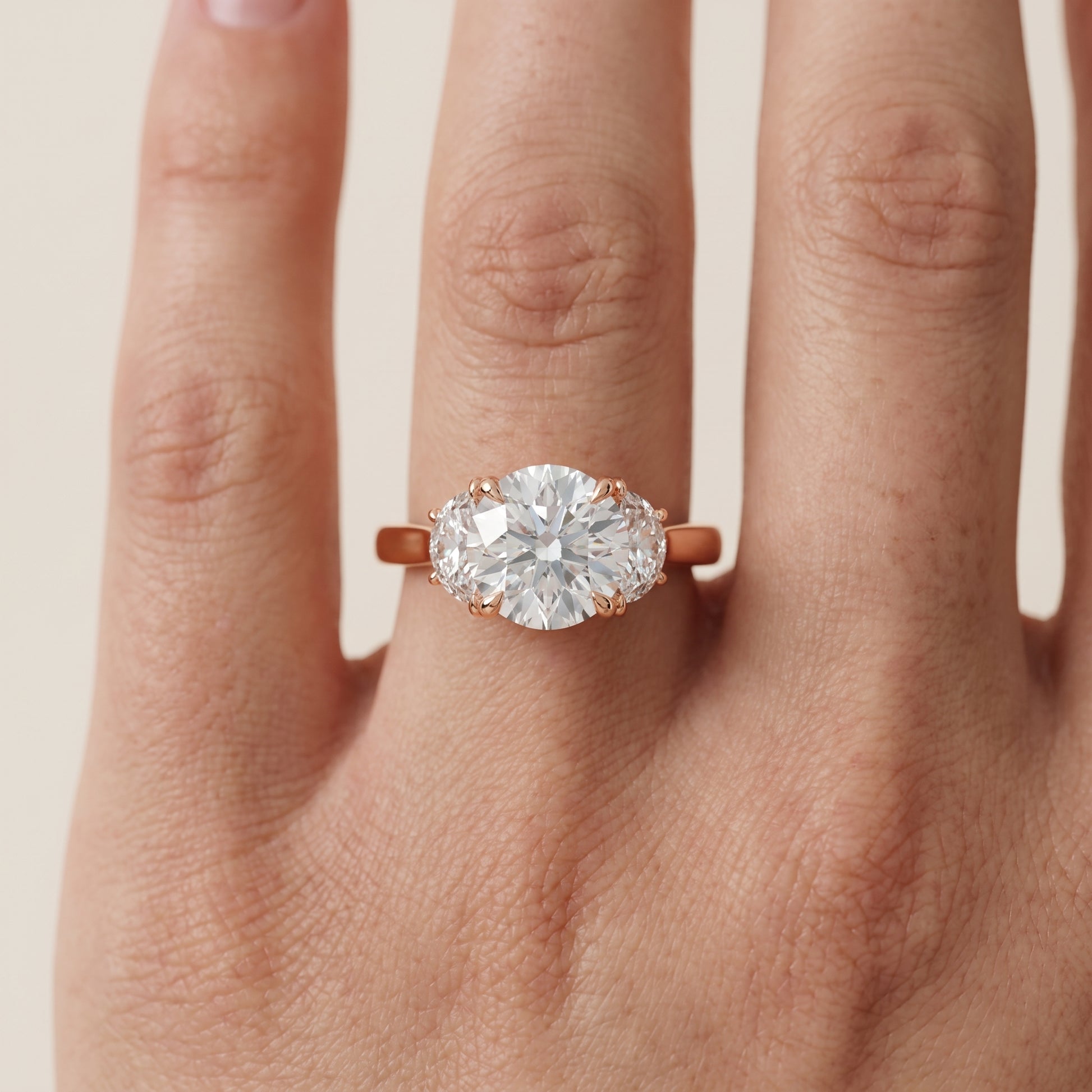 Romy Three-Stone Round Diamond Engagement Ring in Rose Gold - lifestyle.jpg