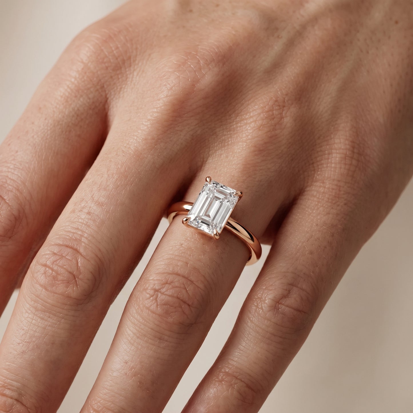 Lyla Petite Solitaire Emerald Diamond Engagement Ring in Rose Gold - lifestyle.jpg
