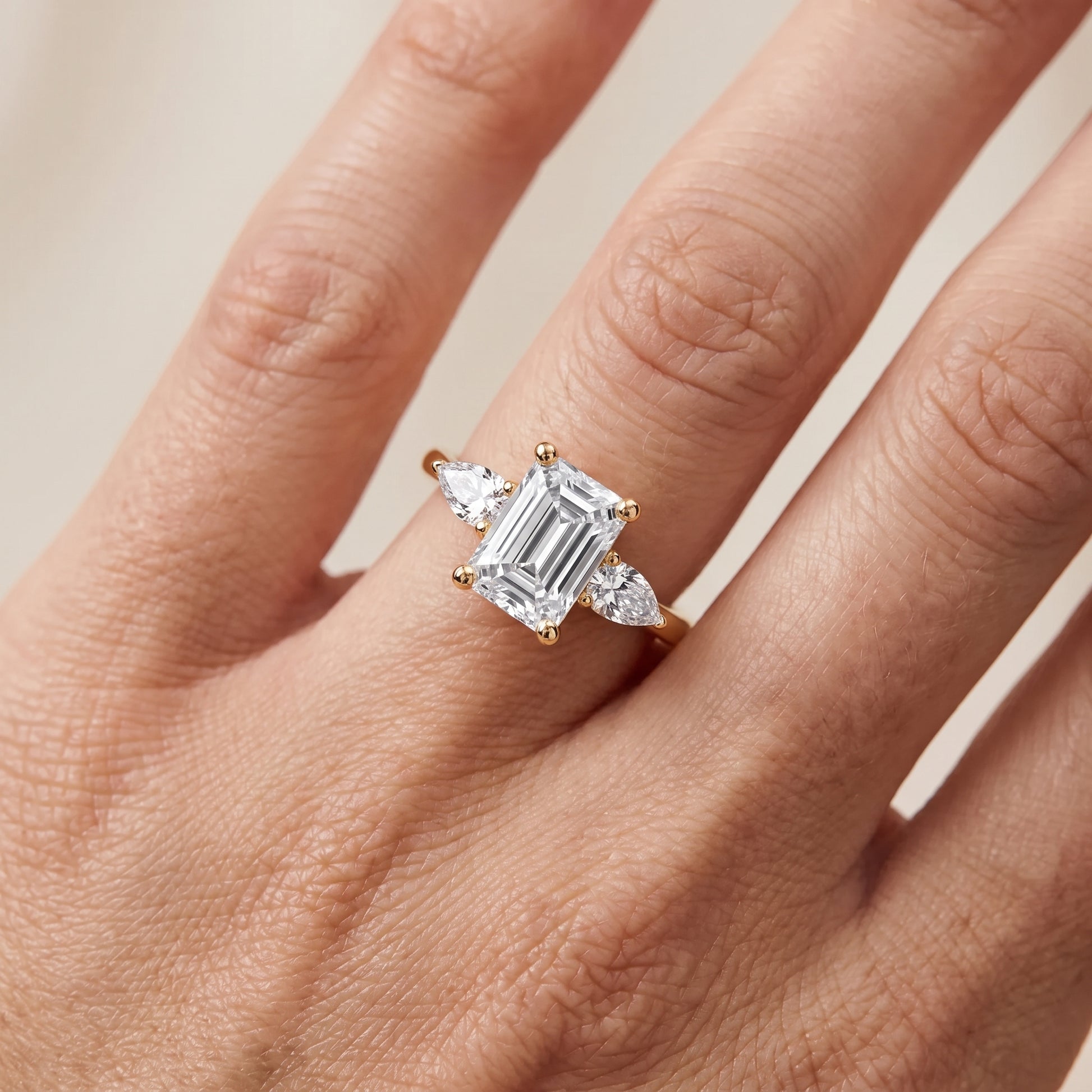 Faye Three-Stone Trellis Emerald Diamond Ring in Yellow Gold - lifestyle.jpg