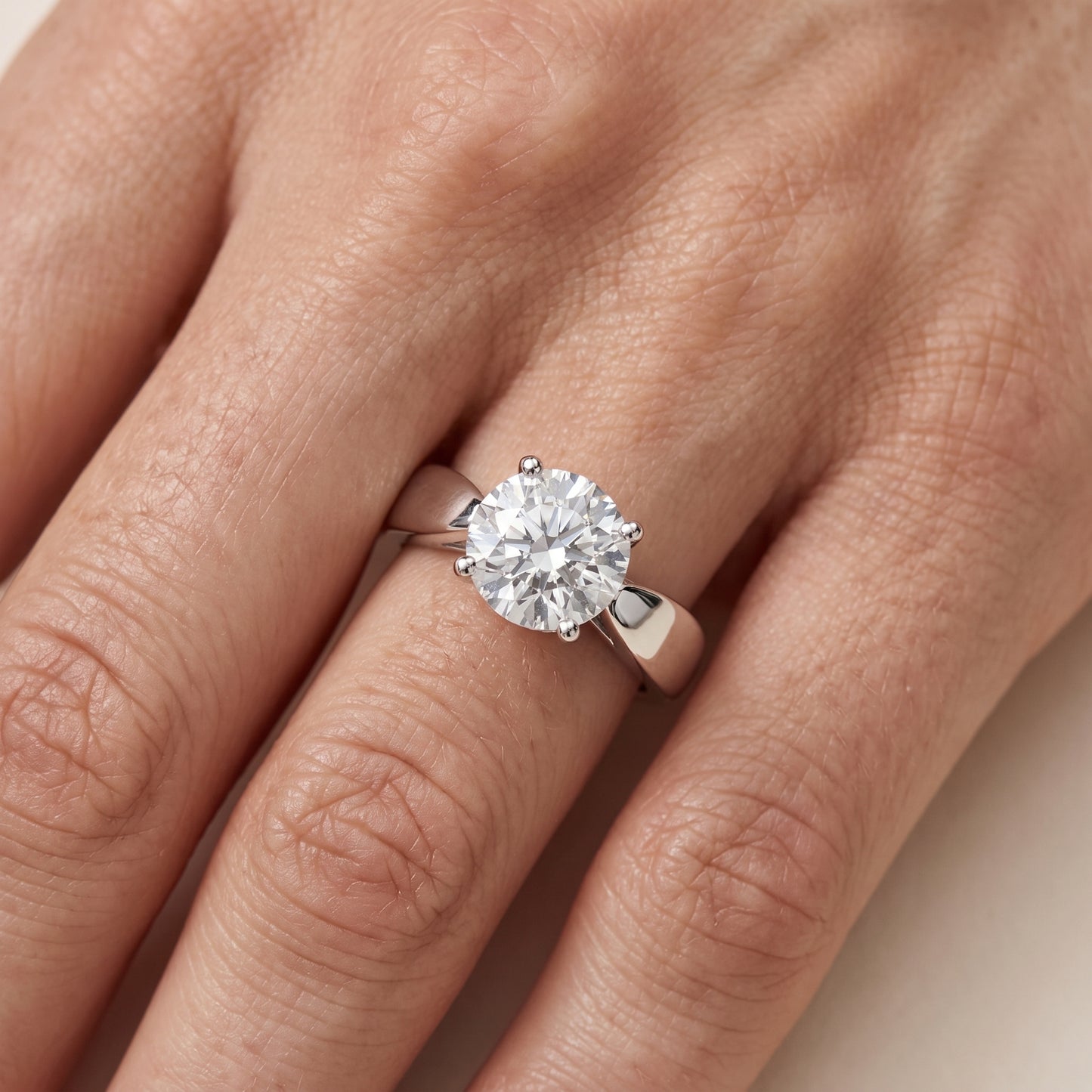 Talia Solitaire Twist Round Diamond Engagement Ring in Silver - lifestyle.jpg