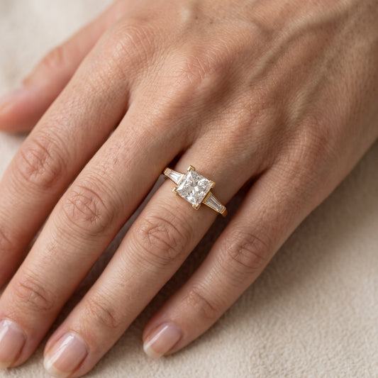 Winnie Three-Stone Princess Diamond Engagement Ring in Yellow Gold - lifestyle.jpg