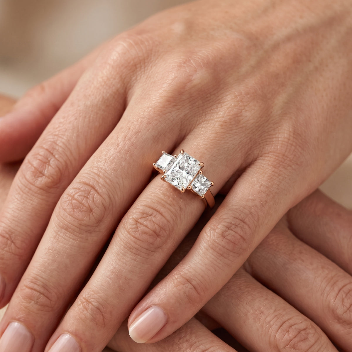 Sienna Three-Stone Radiant Diamond Engagement Ring in Rose Gold - lifestyle.jpg