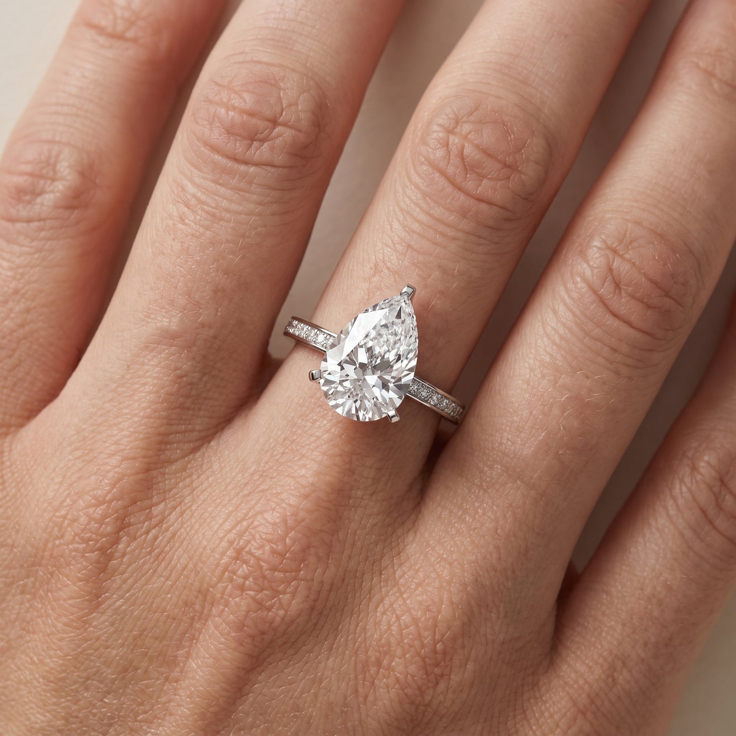Naia Hidden Halo Pear Diamond Ring in White Gold - lifestyle.jpg