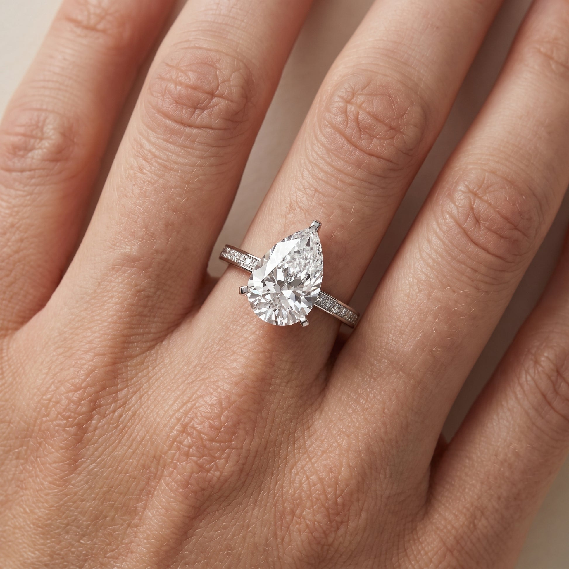 Naia Hidden Halo Pear Diamond Ring in White Gold - lifestyle.jpg