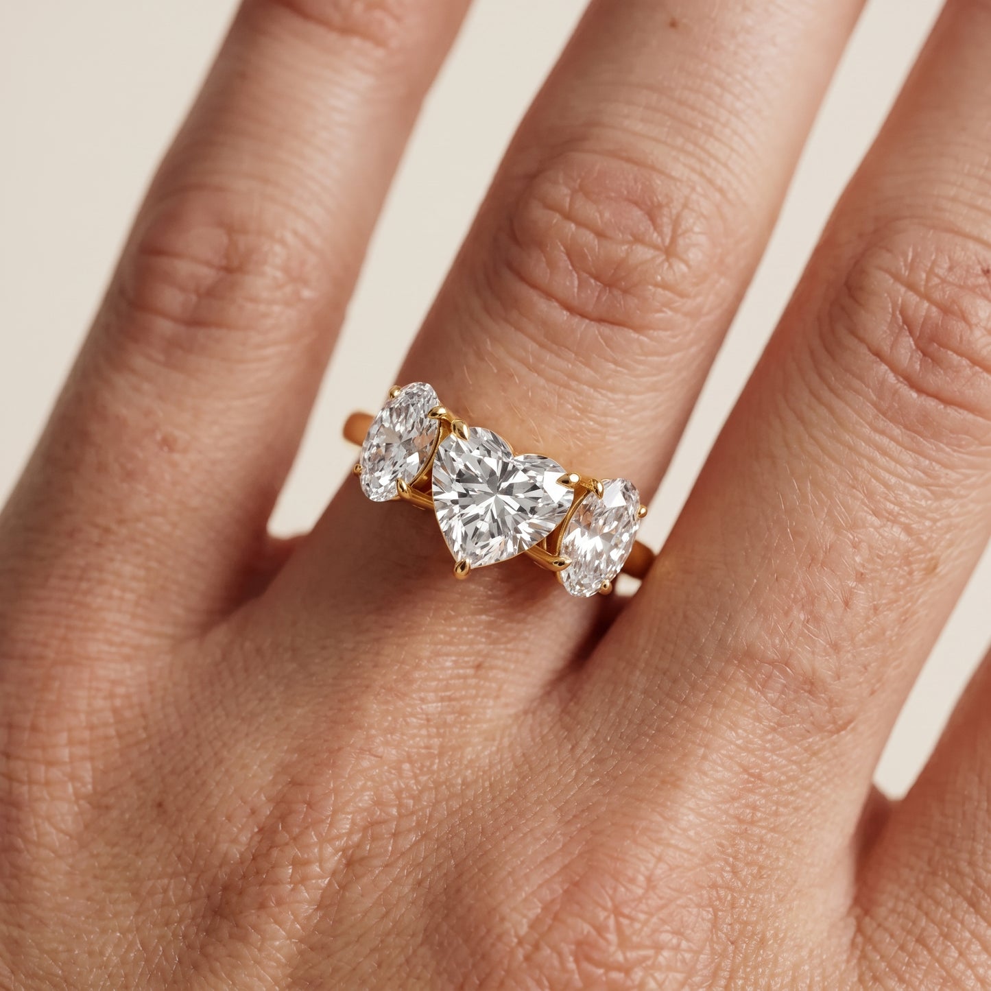 Lila Three-Stone Heart Diamond Ring in Yellow Gold - lifestyle.jpg