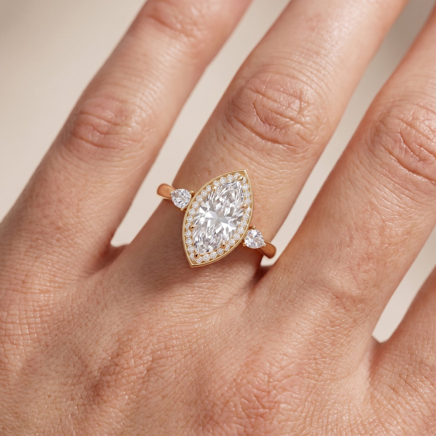 Eliza Halo Sidestone Marquise Diamond Engagement Ring in Yellow Gold - lifestyle.jpg