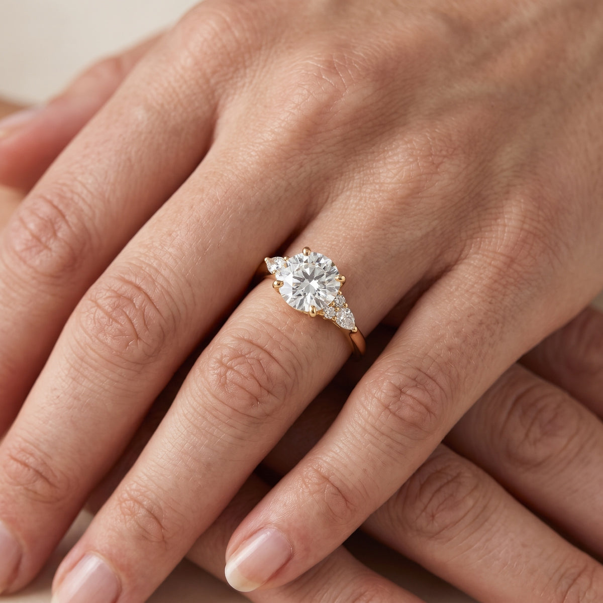 Zelie Pear-Side Cluster Round Diamond Engagement Ring in Yellow Gold - lifestyle.jpg