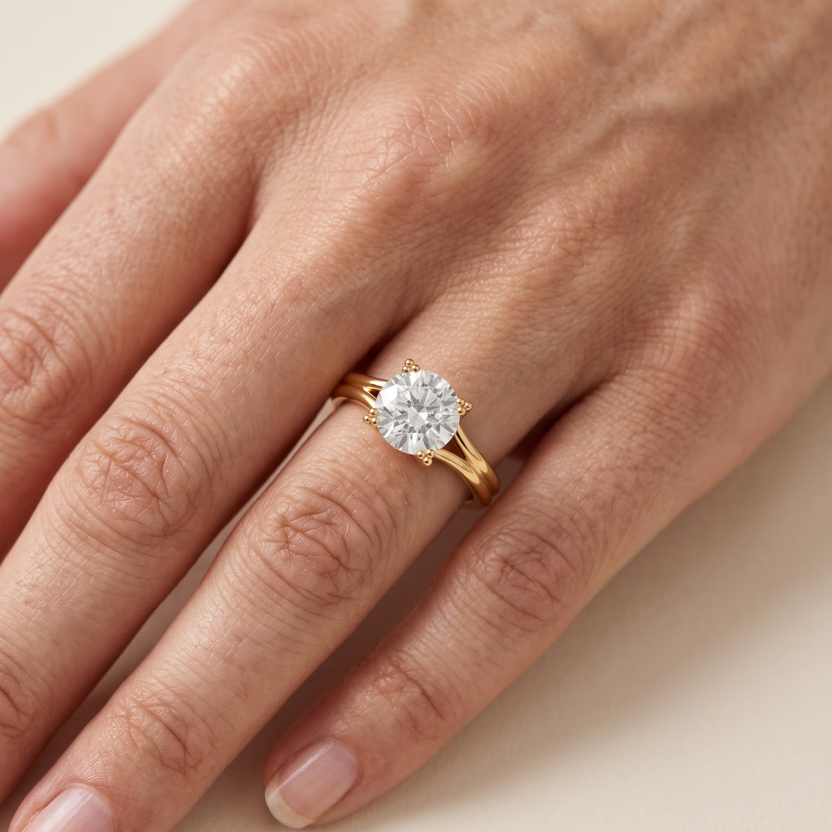 Neve Solitaire Split Shank Round Diamond Engagement Ring in Silver - lifestyle.jpg