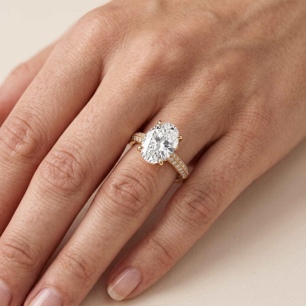 Jasmine Knife Edge Pavé Oval Diamond Engagement Ring in Yellow Gold - lifestyle.jpg